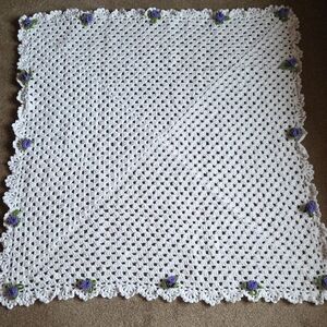 Handmade White Crochet Baby Blanket with Purple Flower Accents